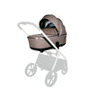 Mocha Lunar II carry cot with canopy and sun protection.