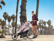 Cybex Zeno multisport running stroller on a sunny beach.